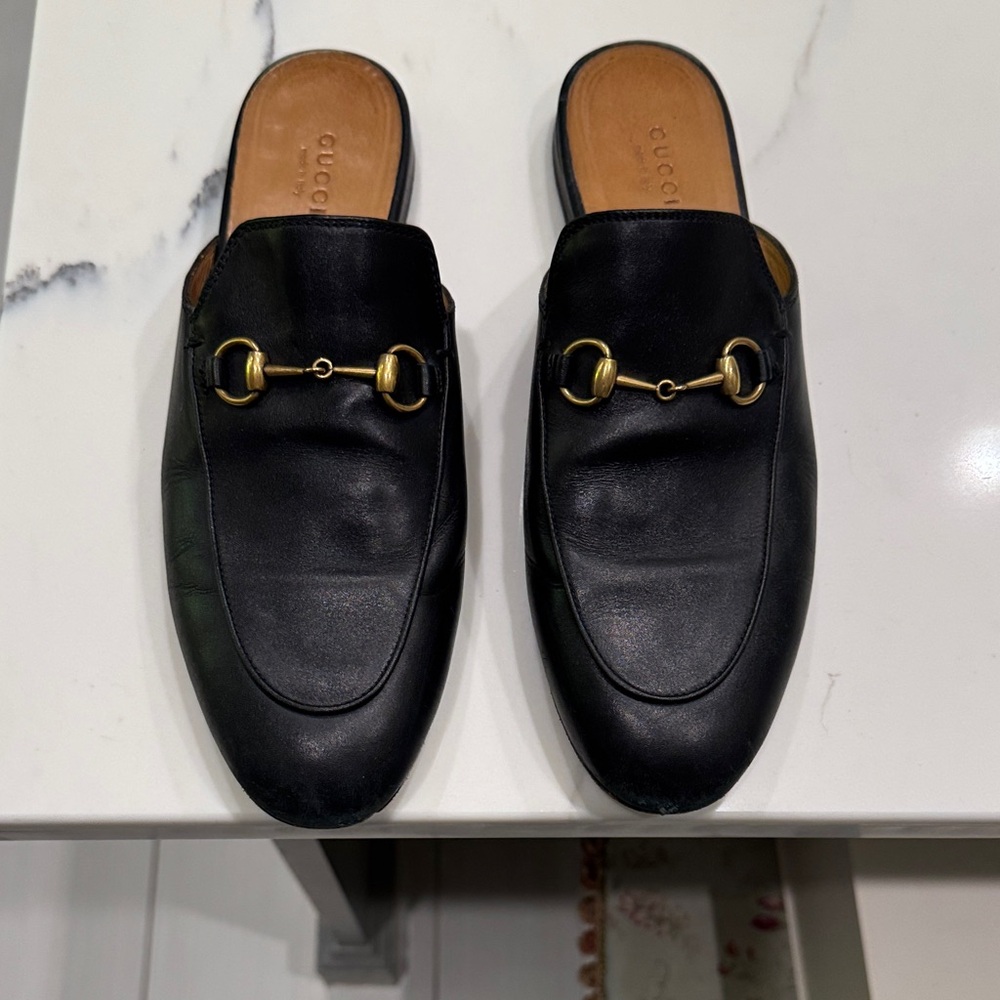 Gucci Black Leather Mules with Gold Accents
